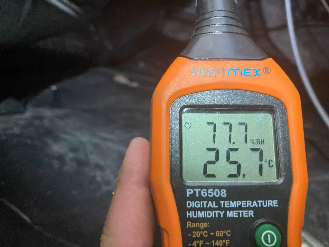 Ground Up Foundation Repair, Waterproofing and Concrete Leveling inspecting high humidity in a crawl space with a digital met