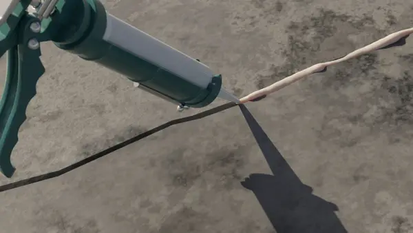Ground Up Foundation Repair, Waterproofing and Concrete Leveling applying sealant for concrete crack repair.