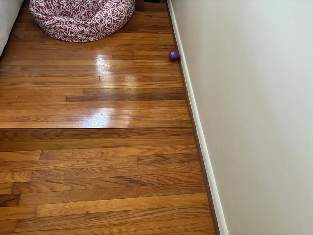 Sagging hardwood floors caused by foundation settlement.