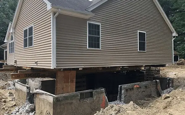 Ground Up Foundation Repair, Waterproofing and Concrete Leveling overseeing a house lifting project for a second story