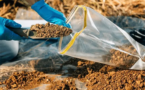 Ground Up Foundation Repair, Waterproofing and Concrete Leveling performing soil testing and inspection for site analysis.